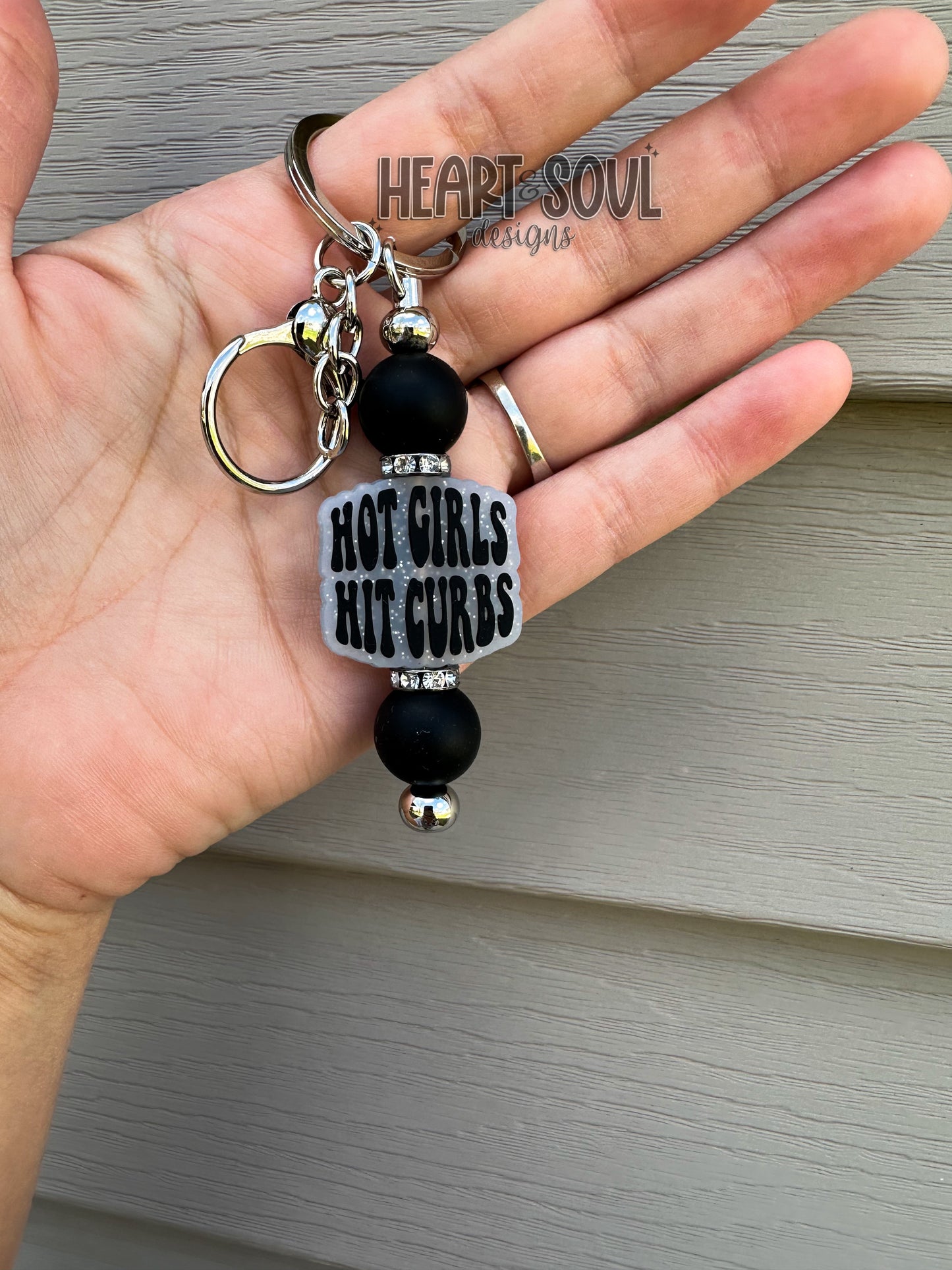 Hot girls hit curbs keychain