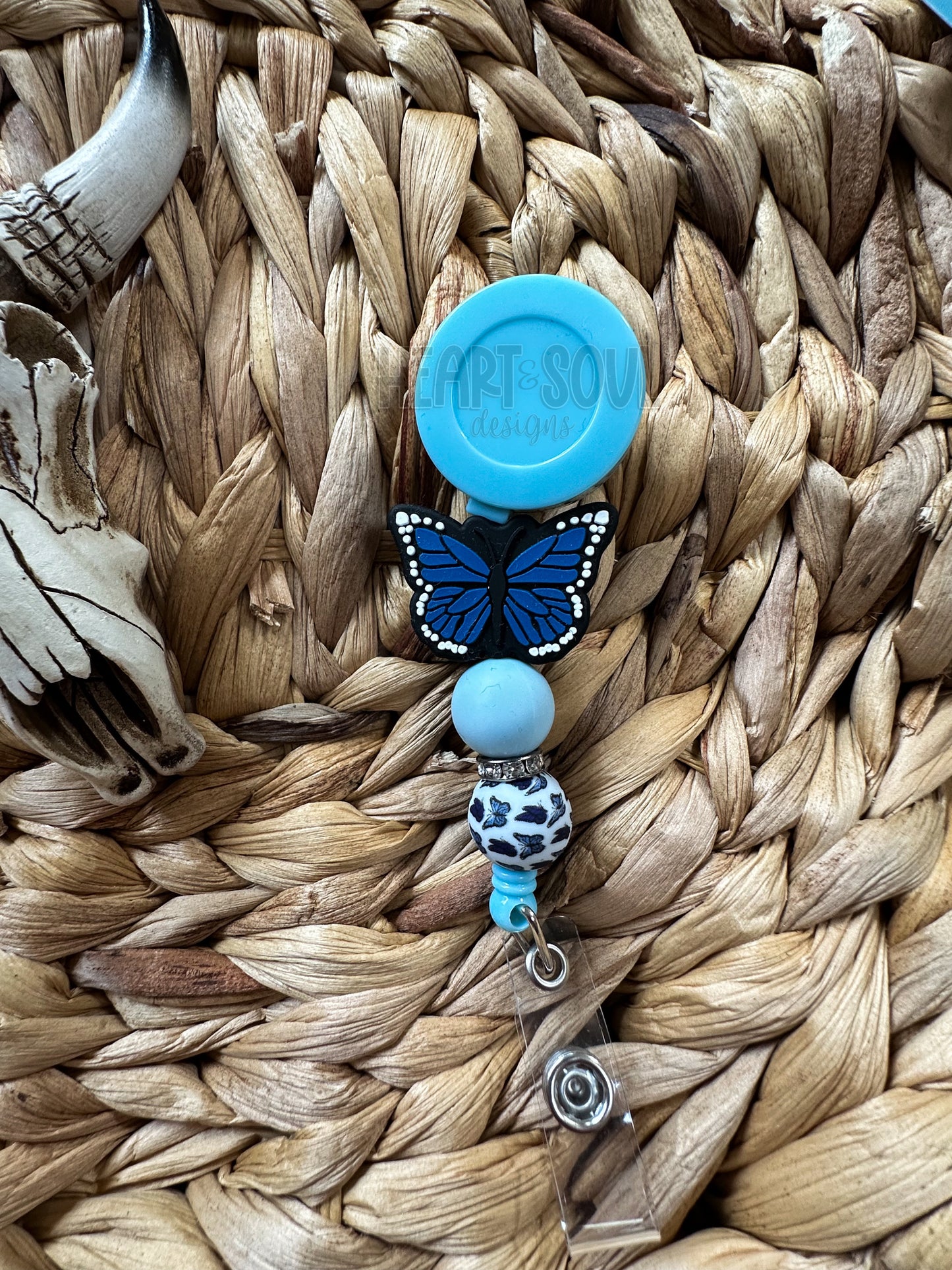 Blue butterfly badge reel