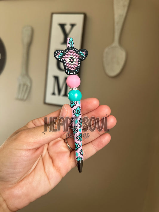 Pink and teal Aztec cow pen