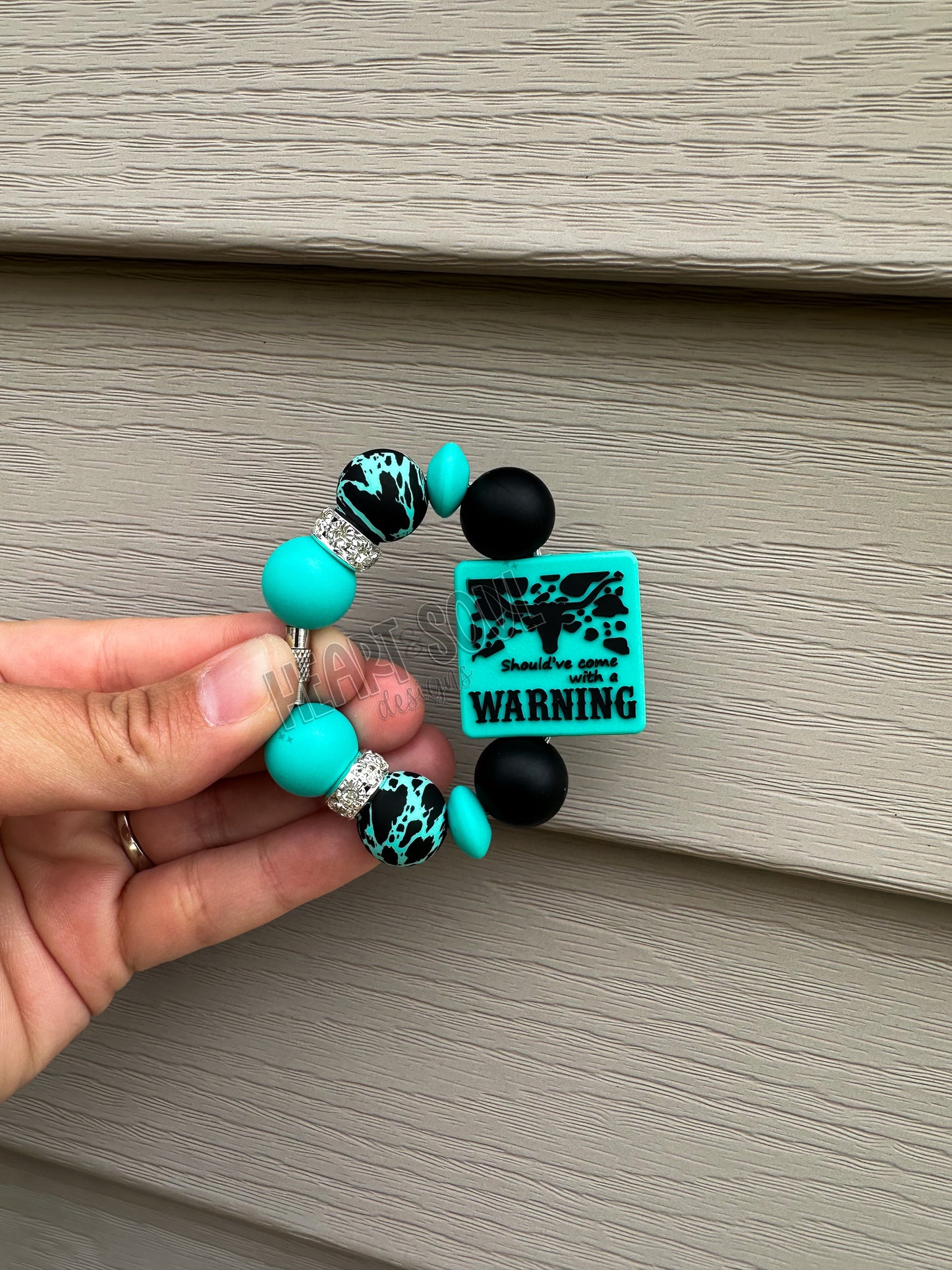 Cowprint teal warning cup charm