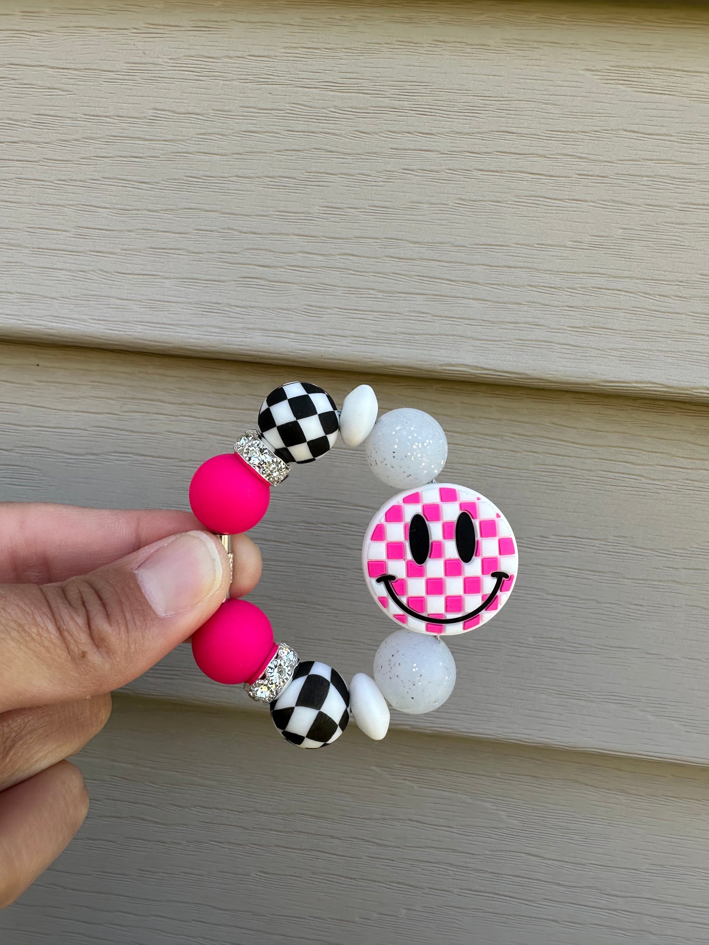 Hot pink checkered smiley